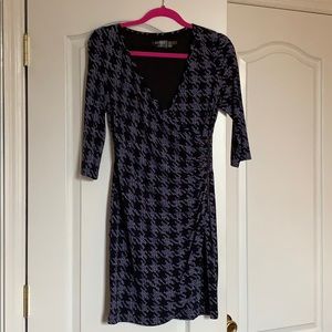 Blue and black patterned faux wrap dress.
